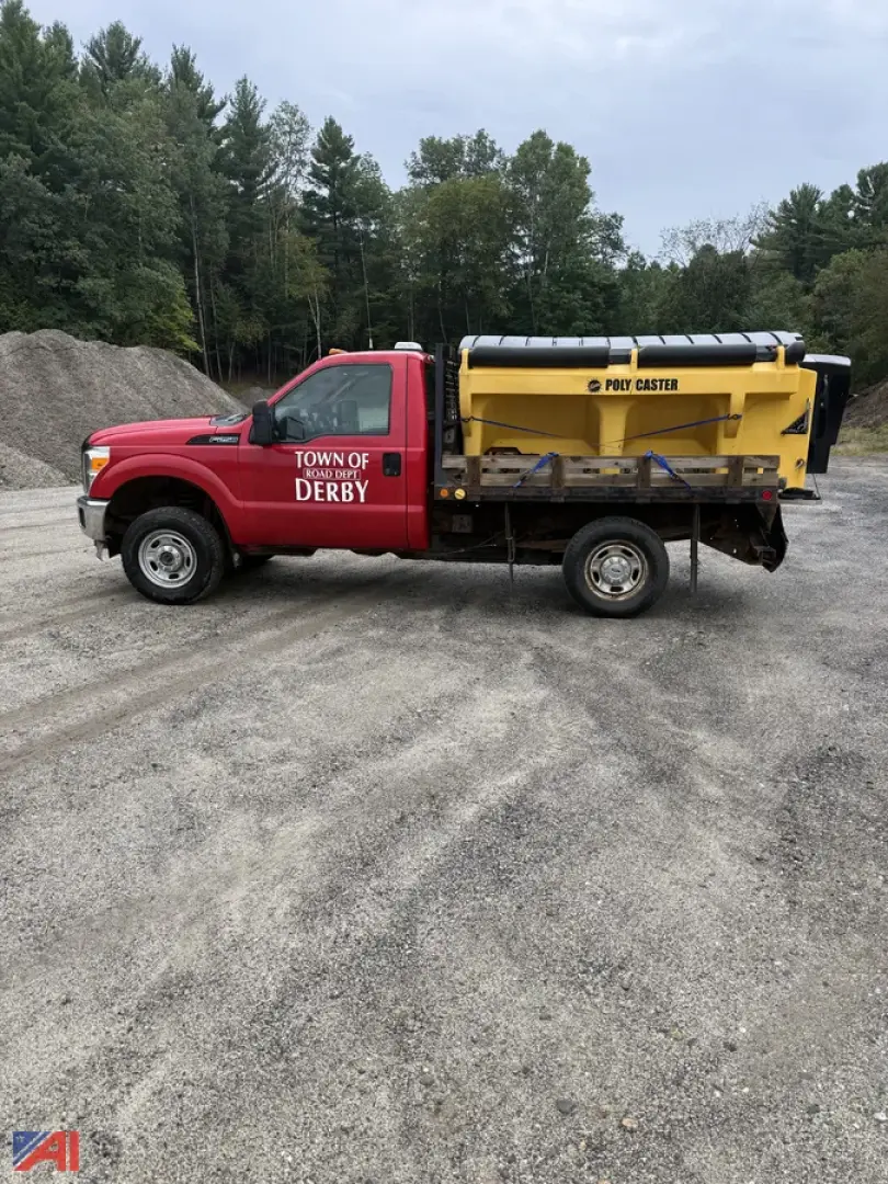 Ford F-250 Super Duty pickup with sander attachment in red cab and yellow dump bed, Town of Derby markings on door.