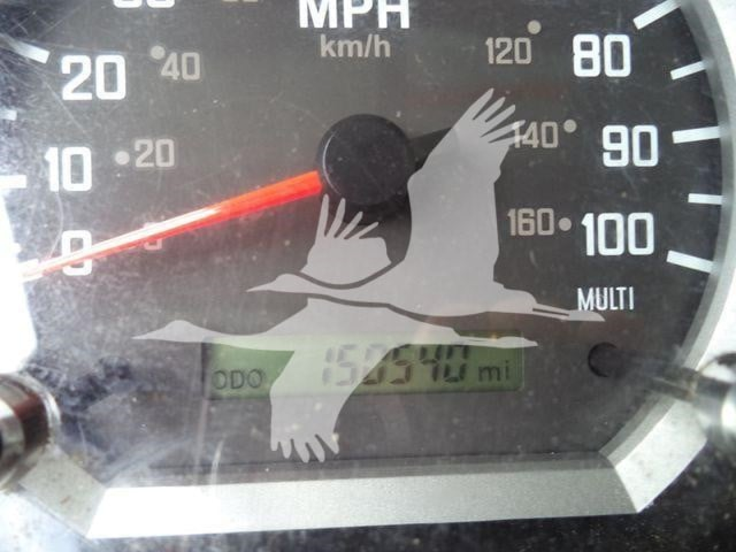 Isuzu NPR-XD gauge cluster showing speedometer with mph, odometer reading and dashboard text visible.