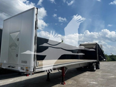Trailer showing curtainside trailer with rear ramp/open tail, sidewall, and landing gear visible; model details not legible.