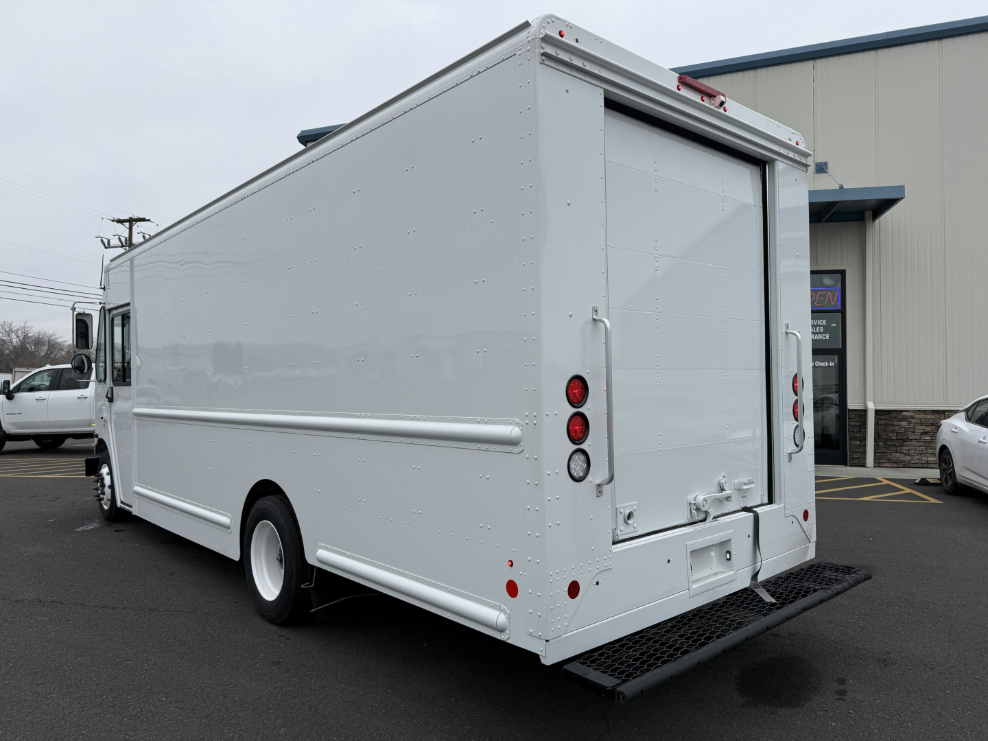 Harbinger S655 box truck rear view showing roll-up cargo door and rear bumper.