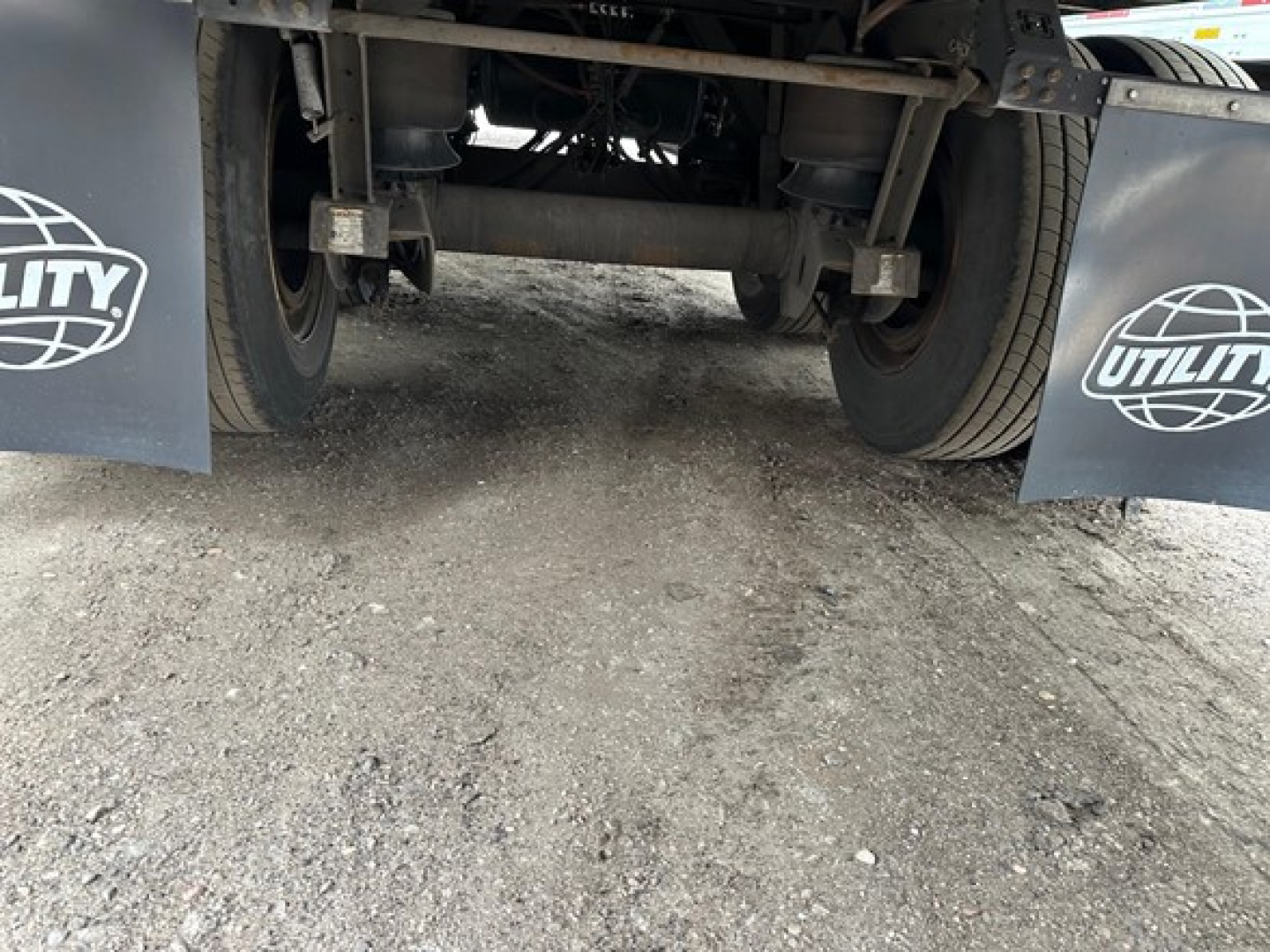 Rear view of Utility 4000Dx trailer showing tandem axles and undercarriage components.