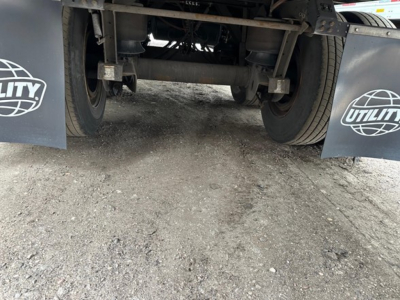 Rear view of Utility 4000Dx trailer showing tandem axles and undercarriage components.