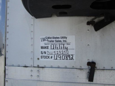 Label on mid-States Utility trailer door showing Make Utility, S/N DU532804, Stock U90892, 2013 date, and trailer sales information.