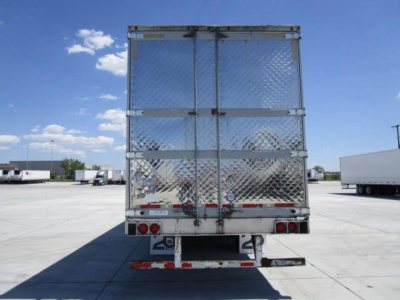 Rear view of a 2013 utility reefer trailer with diamond plate doors, two rear doors, and standard bumper with taillights.