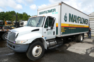2006 International 4300 SBA box truck with Mayflower/McColister transport on side showing box cargo area.
