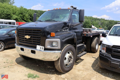 Truck engine bay? No, image shows a 2005 Chevrolet Kodiak C7500 stake dump truck from a front-left view.