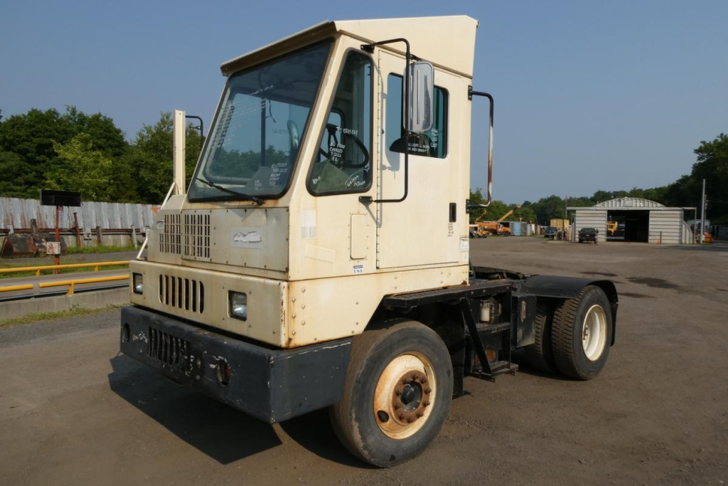 Kalmar Ottawa YT30 yard truck in-service showing front cab, hood, windshield, side mirror, and chassis with rear wheels visible.
