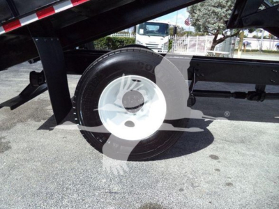 Wheel and lower side of a 2019 International Durastar grapple truck showing rear axle and white rim.