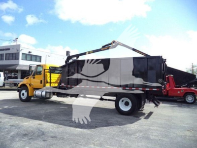2019 International DuraStar grapple truck in side view showing grapple arm and dump body.