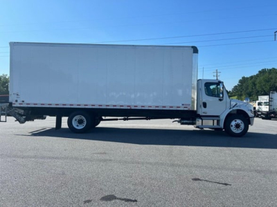 Freightliner M2 106 Plus box truck side view showing cargo box and cab with VIN label area not visible.