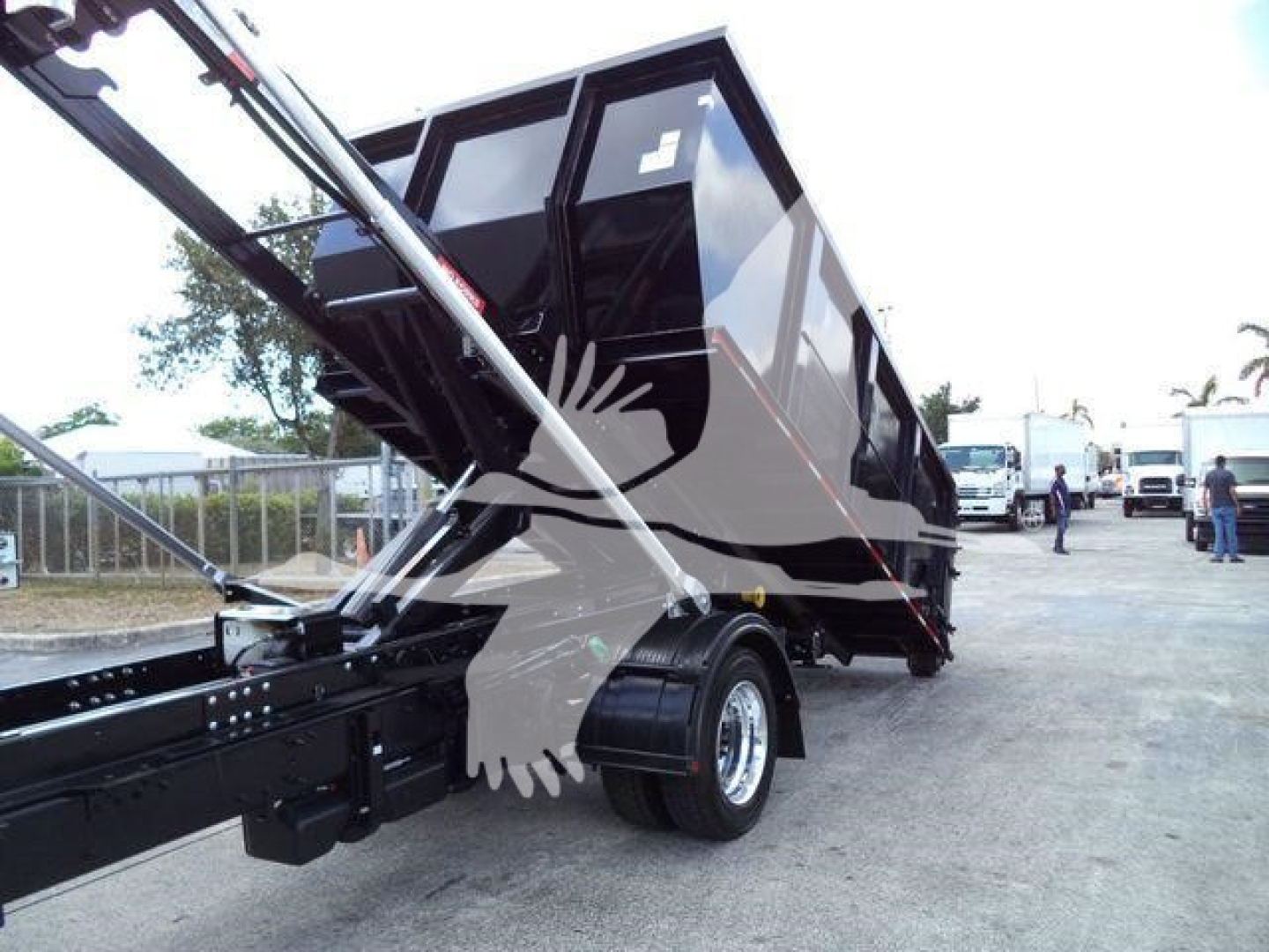 New 2023 International CV roll-off truck with raised dump hopper on a trailer, stock CV515CREW14SNG2.