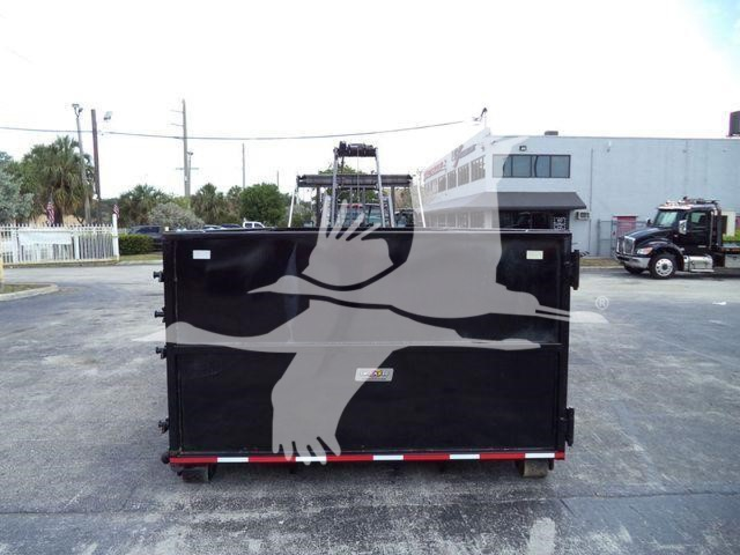 Rolloff truck bed in a yard with stock number CV515CREW14SNG2 and International branding partially visible.