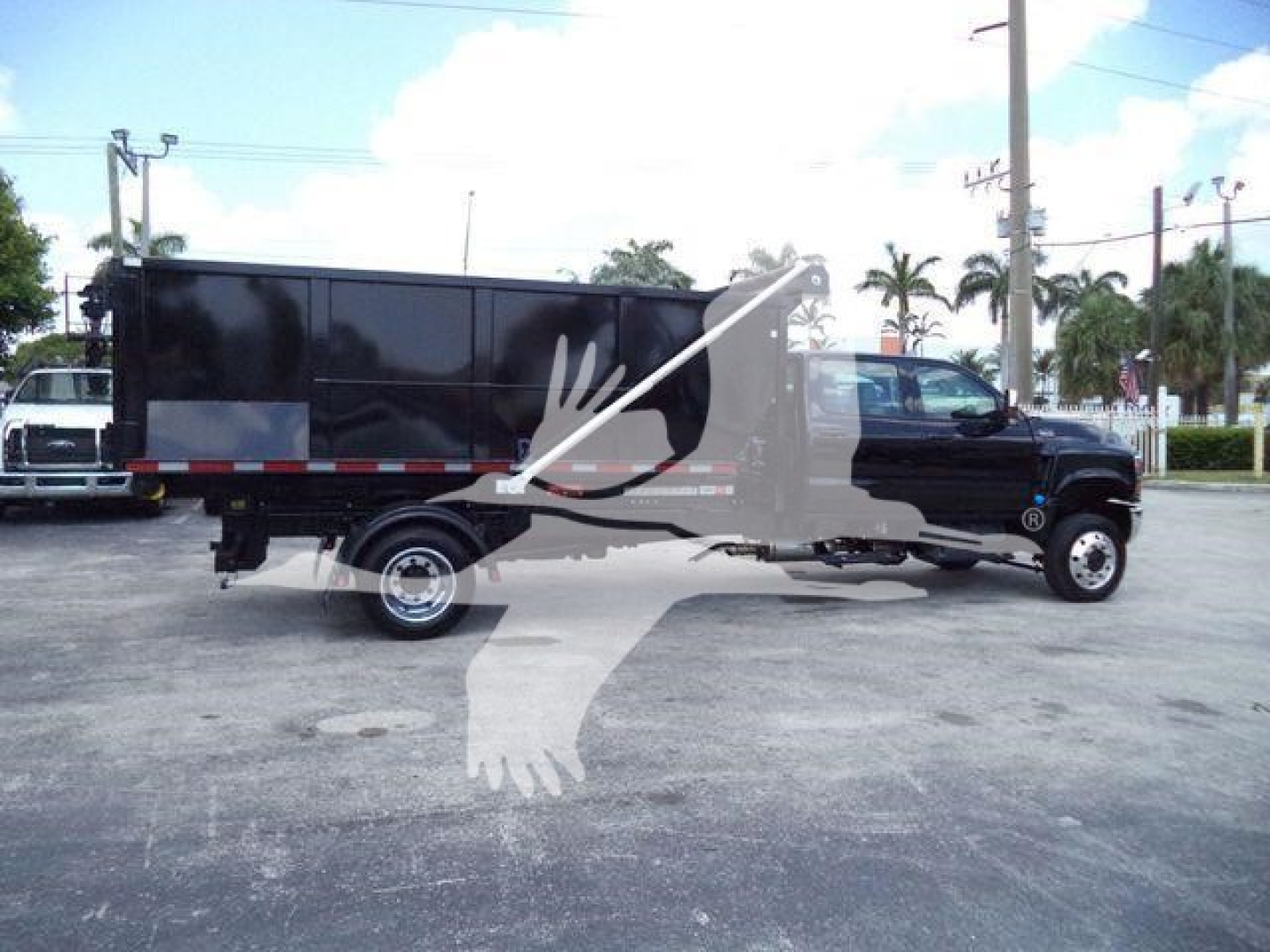 Truck cab and cargo body silhouette with stock number and category overlay.