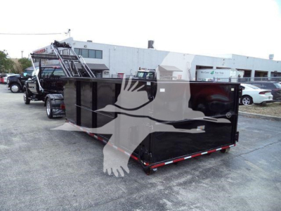 Dump trailer in a lot showing CV515CREW14SNG2 stock number and equipment flags on a black container side.
