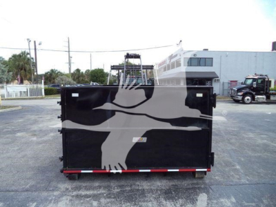 Rolloff truck bed in a yard with stock number CV515CREW14SNG2 and International branding partially visible.