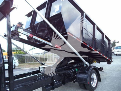 Rolloff truck bed and cab showing black cargo body with hydraulic lift and side panels, International CV15-looking chassis, stock CV515CREW14SNG2.