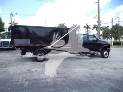 Truck cab and cargo body silhouette with stock number and category overlay.