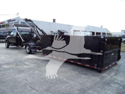 Dump truck with a large black dump bed and a crane truck attached, stock number CV515CREW14SNG2 visible, rolloff category.
