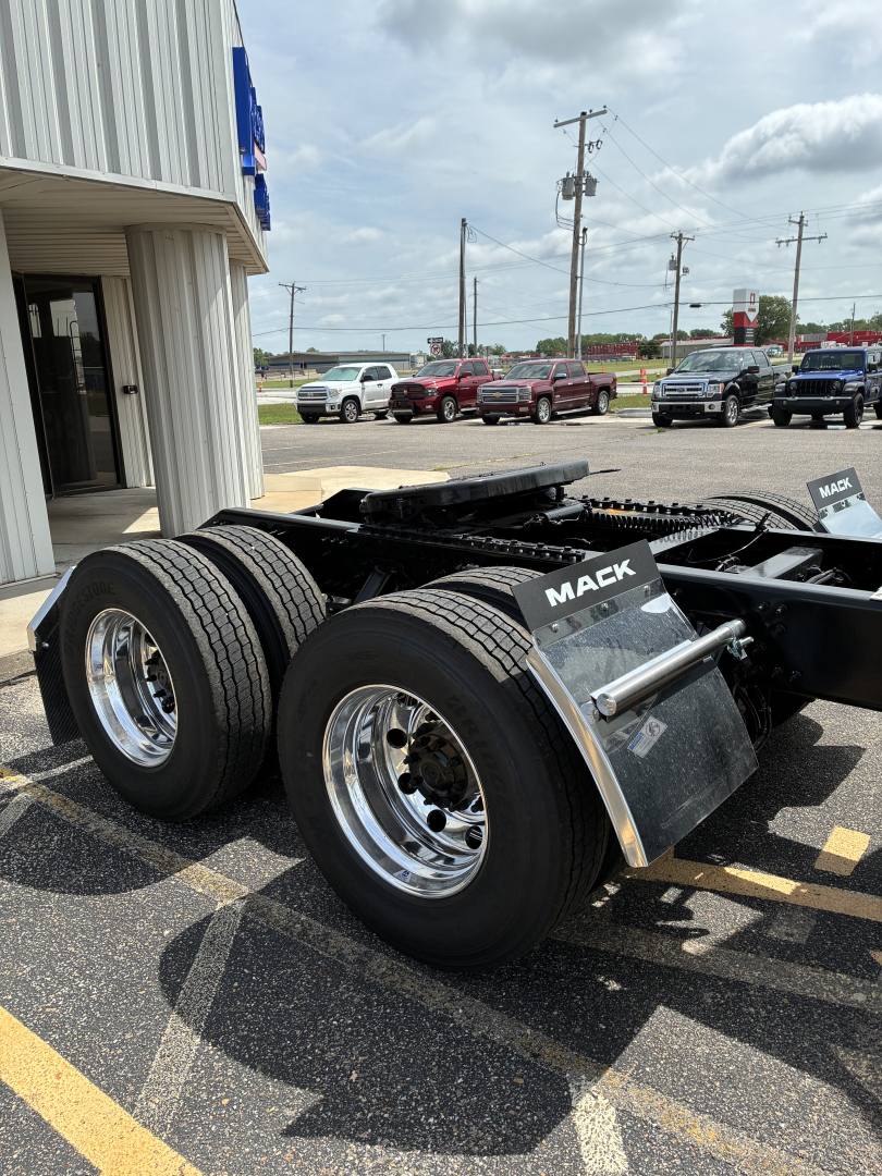 Mack PR64T76H truck tractor rear dual-wheel configuration showing chassis and fifth wheel area with 'MACK' mud flaps.