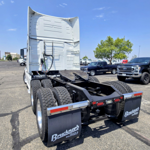 Volvo VNL64T860 truck chassis rear view showing sleeper cab and dual rear axles with mud flaps and Bruckners branding.