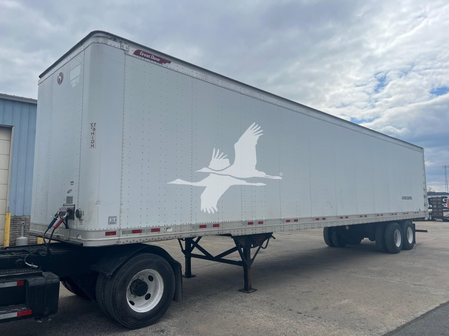 Great Dane sheet and post roll door trailer showing van trailer body with logo on side and dual rear axles.