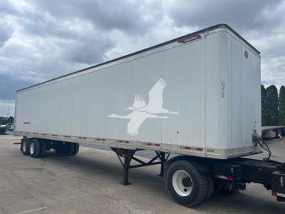 Great Dane sheet and post roll door trailer showing side profile with white exterior and dove graphic.