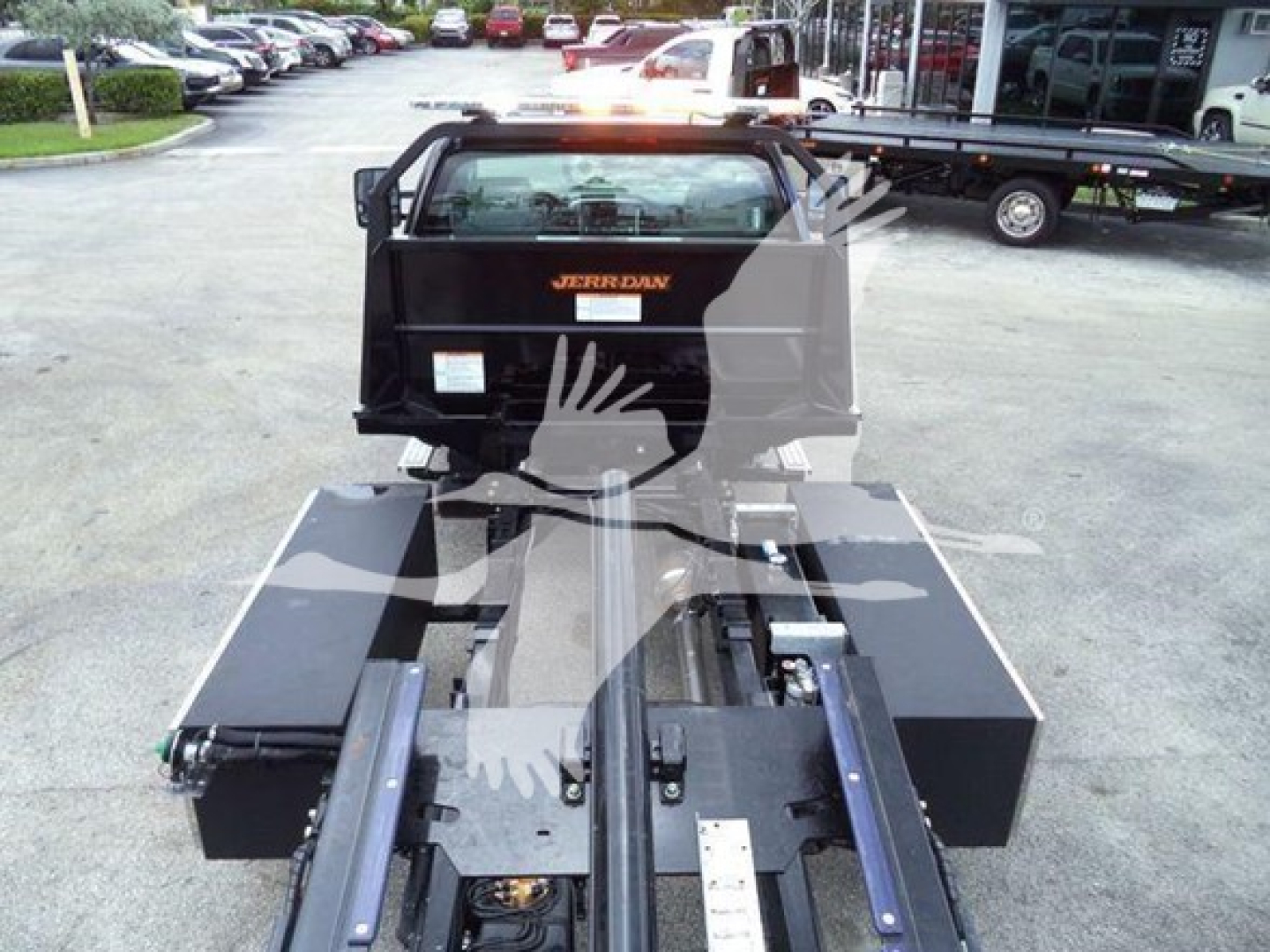 Truck bed with Jerrdan tow bed mounted, rear view showing hydraulic components and platform for Silverado 6500HD rollback