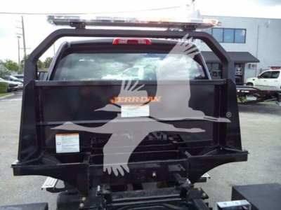 Truck bed of a 2023 Chevrolet Silverado 6500Hd rollback showing Jerr-Dan branding and rear view with lift equipment.