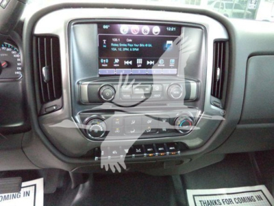 Chevrolet Silverado 6500HD dash area showing touchscreen infotainment and climate controls.