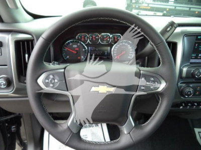 Dashboard and steering wheel of a Chevrolet Silverado 6500HD interior view.