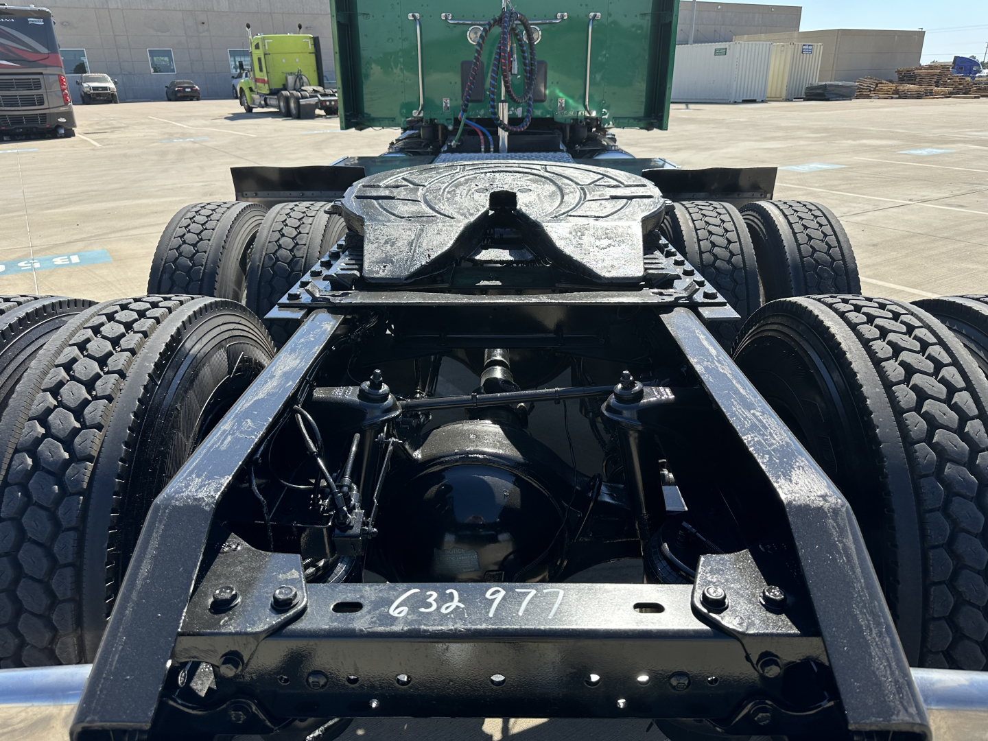 Kenworth T680 rear chassis showing tandem axle assembly and fifth wheel on a used truck.