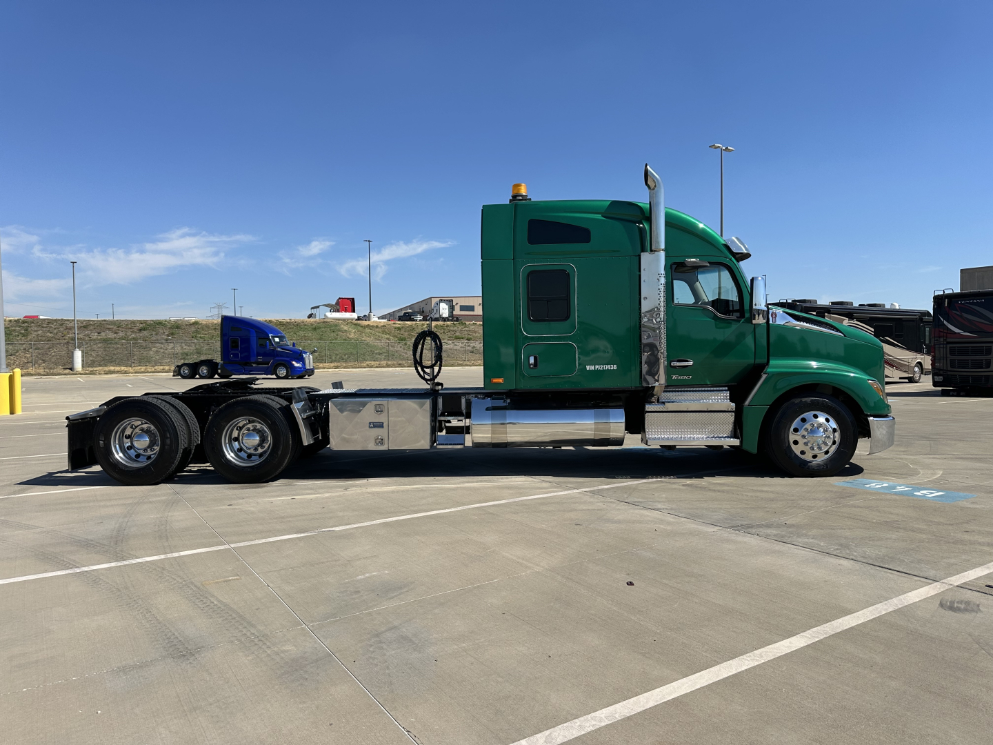 Kenworth T680 conventional sleeper in green with extended cab, side profile view, 6x4 tractor with dual rear axles, chrome fuel tanks, and black chassis.
