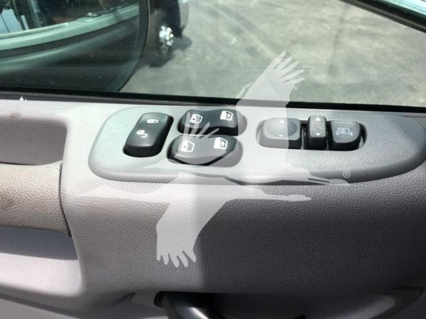 Peterbilt 337 truck interior door panel showing power window and mirror control switches.