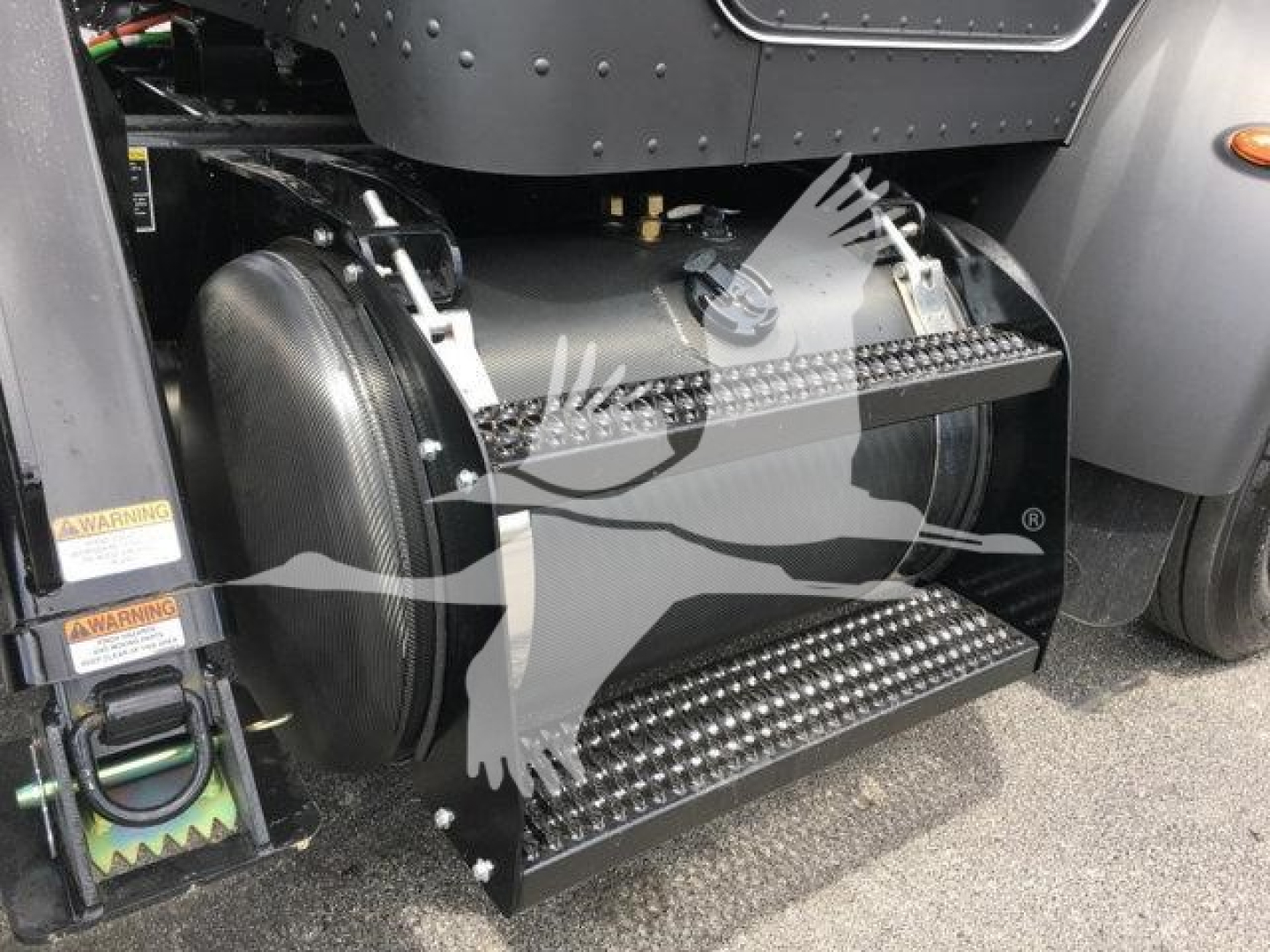Peterbilt 337 rollback truck step/footboard and air tank visible under cab.