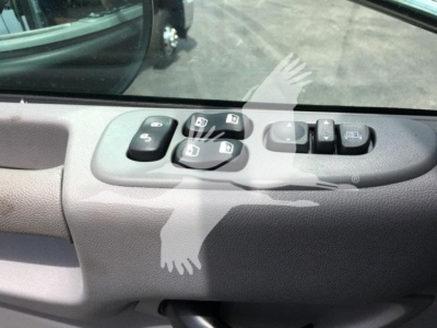 Peterbilt 337 truck interior door panel showing power window and mirror control switches.