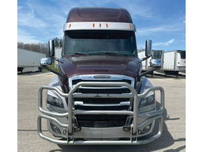 Front view of Freightliner Cascadia126 with bull bar grille guard on chrome bumper and large mirrors.