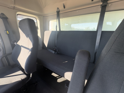 Freightliner M2-106 interior showing seating and safety belts.