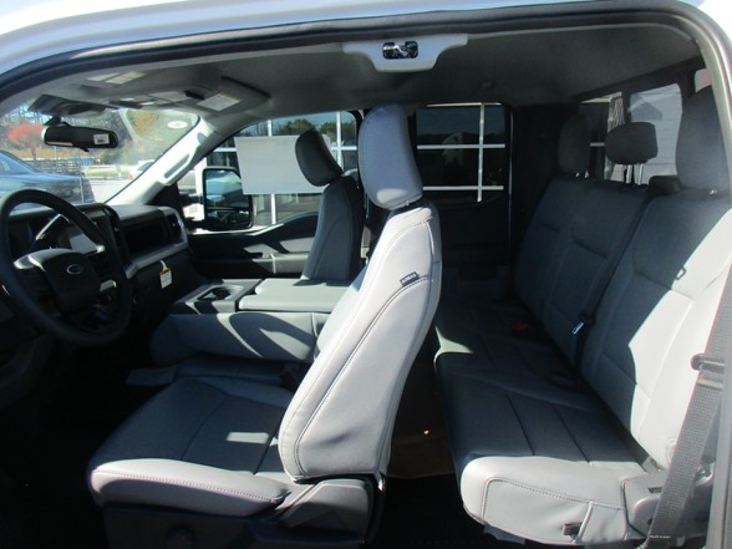 Ford F-350 Cab and Chassis interior showing front seats and extended cabin.
