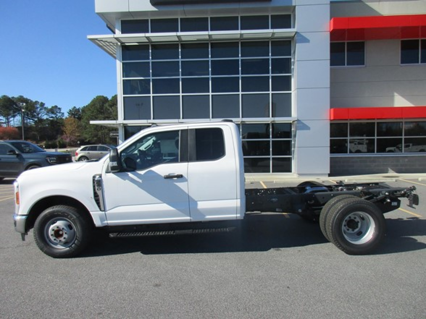 Ford F-350 Cab and Chassis side view showing white truck with chassis frame extending behind cab.