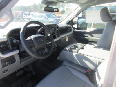Ford F-350 cab and chassis interior showing steering wheel dashboard center console and front seats