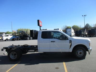 Ford F-Series cab chassis truck side view showing blank bed frame and wheelbase.