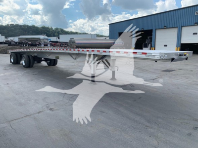 Flatbed trailer with extendable deck showing 2026 Reitnouer CK-100 trailer, VIN 1RNF48A23TR065774, stock TR065774, in a yard.