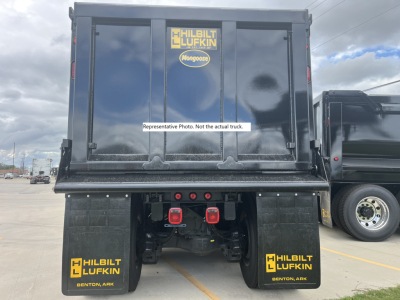 Dump truck rear showing cargo bed with HILBILT LUKFIN and Mongese stickers, two red taillights, and mud flaps reading HILBILT LUFKIN Benton, AR.