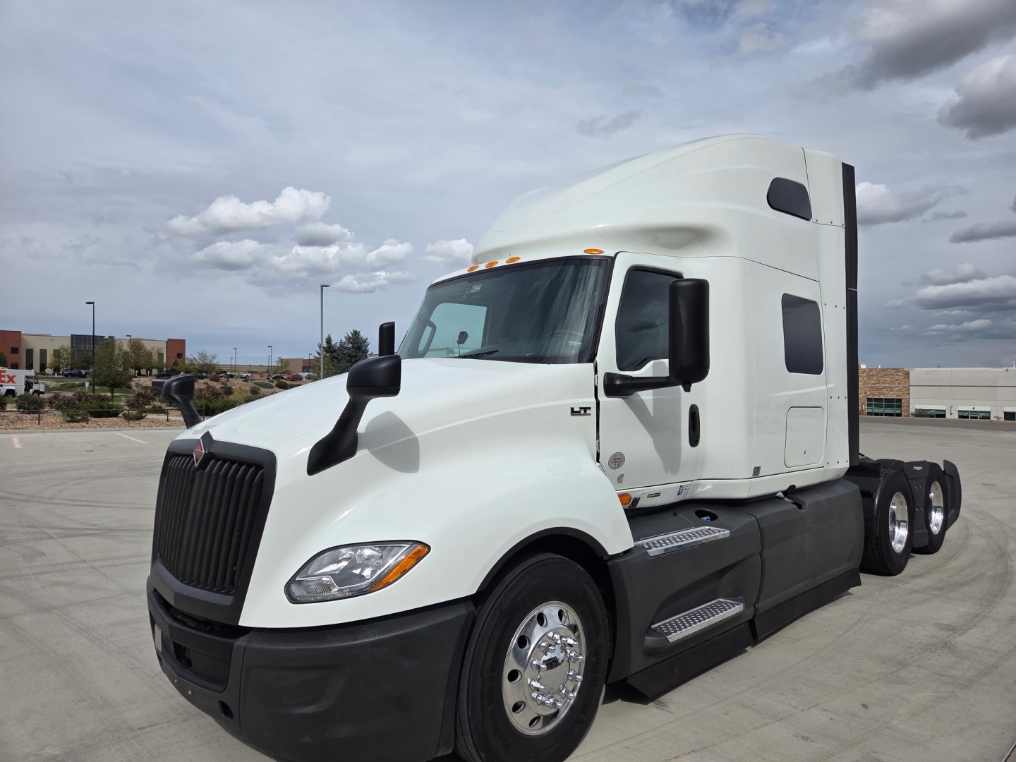 International LT625 truck tractor side view showing sleeper cab and dual rear axles.