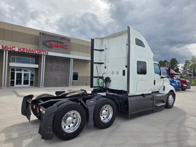 Truck tractor 2023 International LT625, side view showing cab and rear tandem axles.