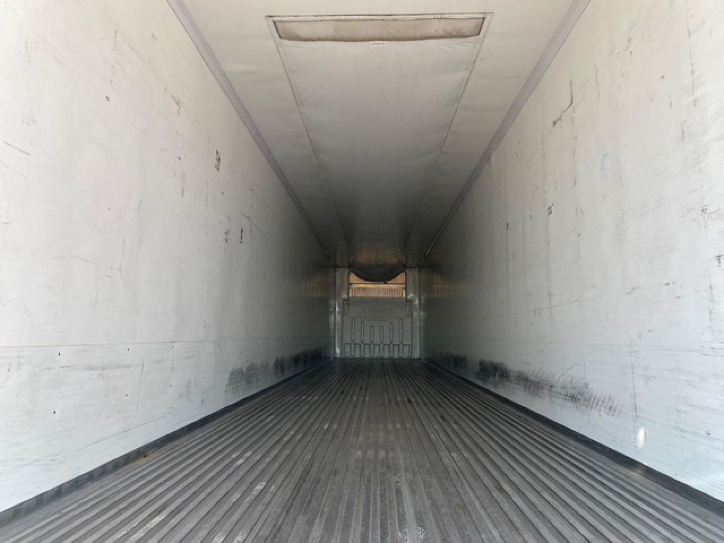 Trailer interior view of a 2020 Wabash reefer showing white walls and ribbed floor.