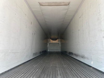 Trailer interior view of a 2020 Wabash reefer showing white walls and ribbed floor.