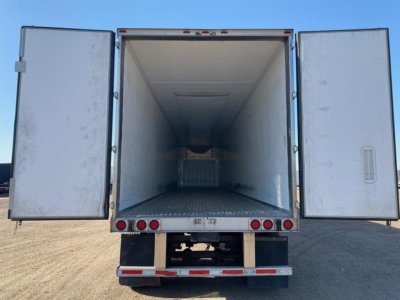 Refrigerated trailer interior view with doors open, empty cargo space in a 2020 Wabash reefer.