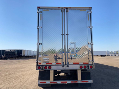 Rear view of a 2020 Wabash refrigerated trailer showing double rear doors with diamond plate, safety reflectors, and rear bumper.