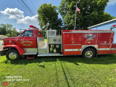 GMC Topkick 7000 Pumper fire truck side view showing South Butler Fire Dept lettering and equipment compartments.